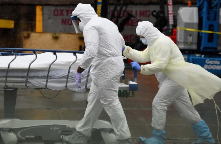 Two states bring in refrigerated trucks as morgues fill up