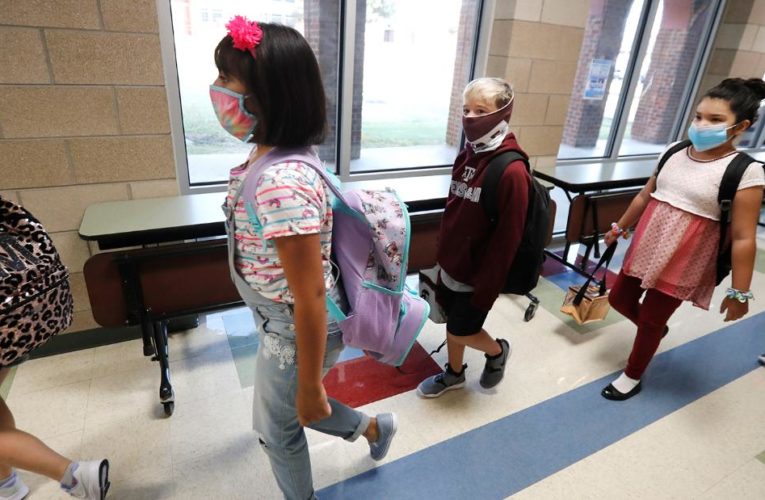 As schools reopen, 97,000 kids tested positive in 2 weeks