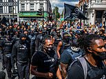 Dozens of protesters aiming to ‘lock down’ Brixton march down London streets