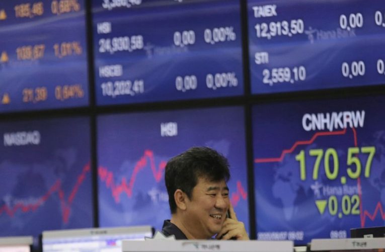 Global shares skid amid virus woes, China-US trade tensions