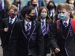 Majority of schoolchildren in England and Wales return to classes for first time in six months today