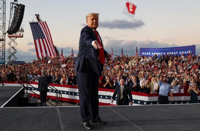 Trump behaved as though the deadly pandemic was a memory in front of a packed-in crowd, even with chilling new warnings about the resurgent coronavirus