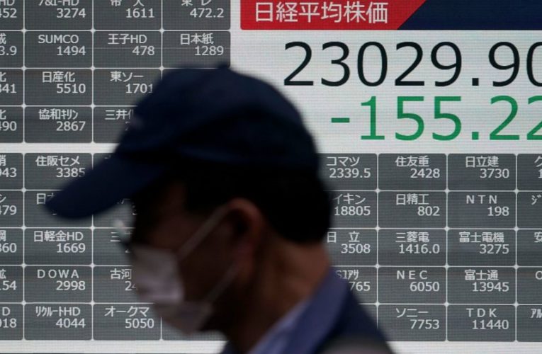 Stocks slip after Trump tests positive, job growth slows