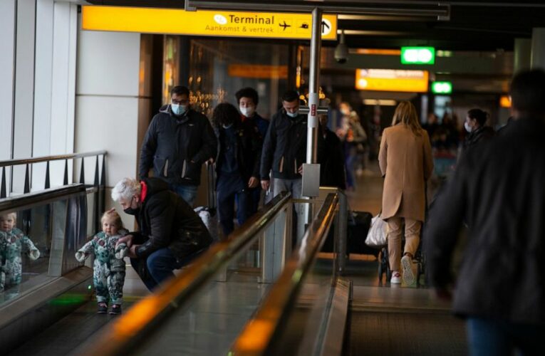 The Latest: Belgians, Dutch halt UK flights, fearing variant
