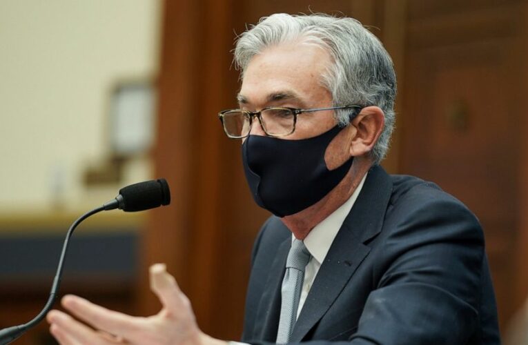 Fed keeps rate near zero but sees brighter economy in 2021