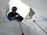 Skier films plunging into a mountain crevasse and is buried under snow 