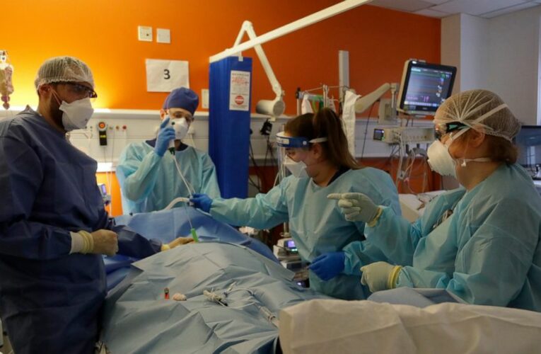 The Latest: Israel extends virus shots to those 35 and older