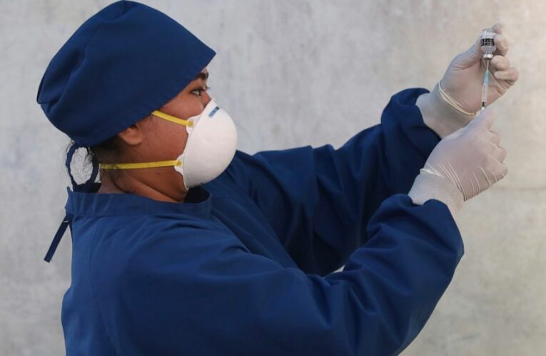 The Latest: China ponders approving 2 more COVID-19 vaccines