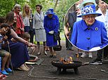 Queen looks radiant in vibrant coat and matching hat as she joins Princess Anne in Scotland