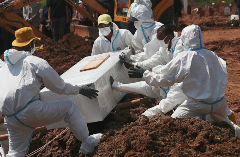 The Latest: CDC leader: Masks, vaccination could halt surge