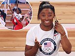 Simone Biles cheers on gymnastics teammates while sitting in the stands