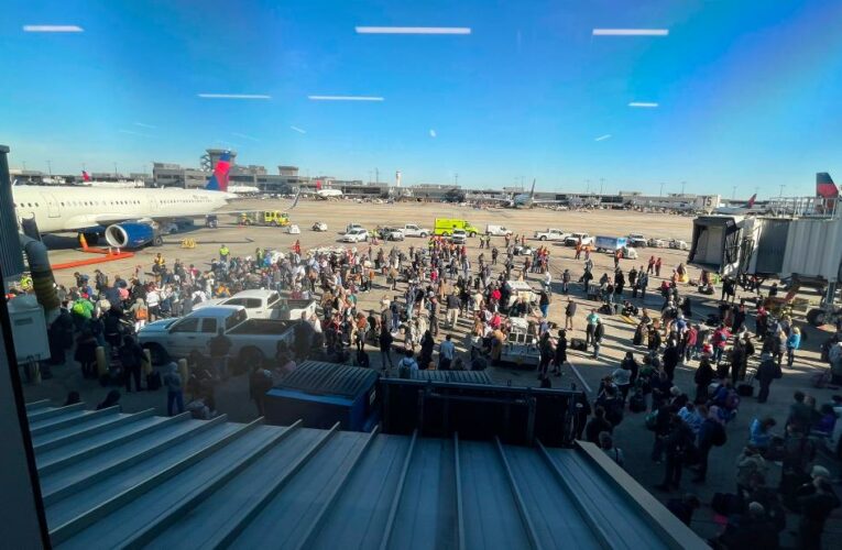 Travelers describe chaotic scene and running for cover at Atlanta’s international airport when an ‘accidental’ weapon discharge briefly halted flights