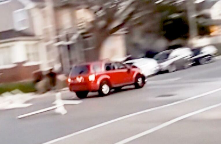 Video shows SUV speed past parade participants