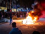 Police fire warning shots at protesters in Rotterdam as tensions boil over at new Covid restrictions