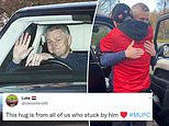 Ole Gunnar Solskjaer hugs Manchester United fan waiting outside Carrington as he makes final exit