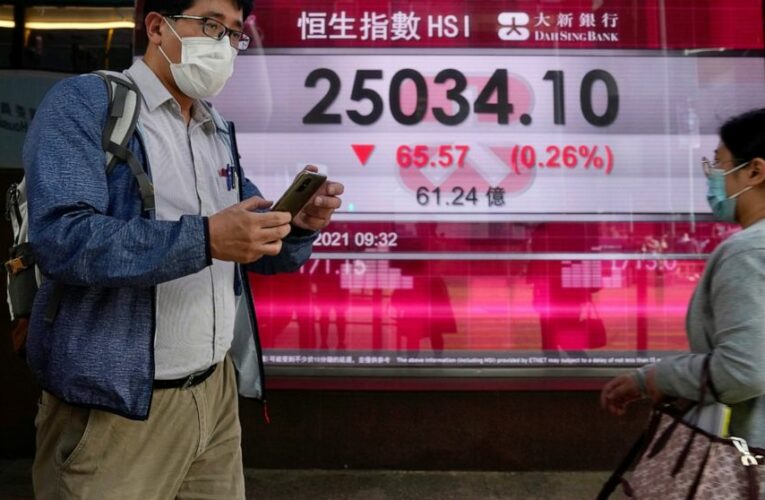 Stocks rise after Fed says it will dial back aid for economy