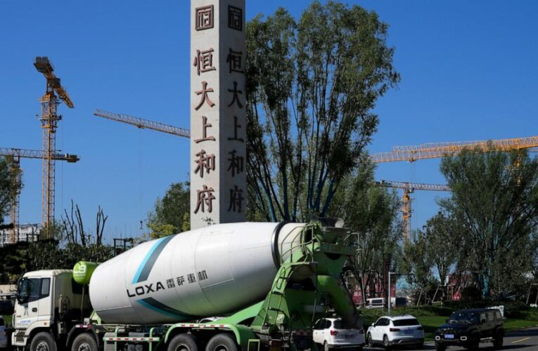 Asian shares slide after China Evergrande warns of cash woes