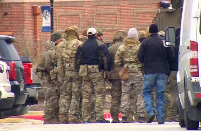 There are believed to be at least four hostages, law enforcement official says