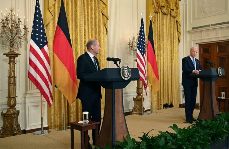 The German chancellor declines to back Biden’s pledge to halt the pipeline but promises a unified response