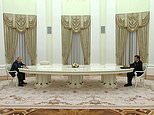 Putin welcomes Macron to Kremlin but keeps him away with the help of a massive table 