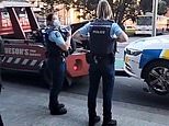 Bizarre moment police monitoring a anti-vaxx protest in New Zealand have their patrol car TOWED