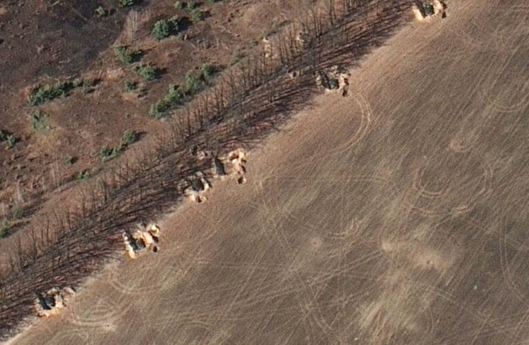 Russia is constructing earthen berms to protect military positions northwest of Kyiv