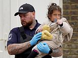 Little girl clutches cuddly toy as she’s carried ashore after 80 migrants landed in Dover today